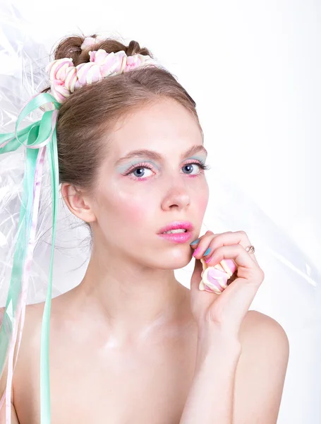 Young woman with marshmallow makeup style beauty fantasy.