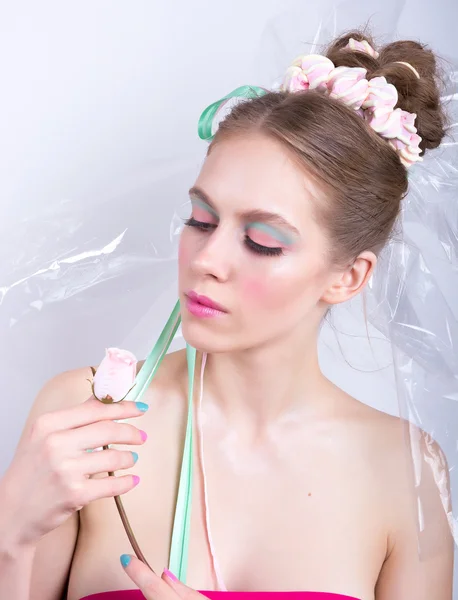 Young woman with rose, marshmallow makeup style, beauty fantasy.