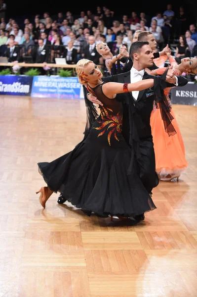 Dance couple in a dance pose during Grand Slam Standart