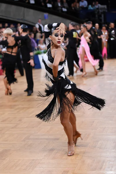Female latin dancer dancing during competition