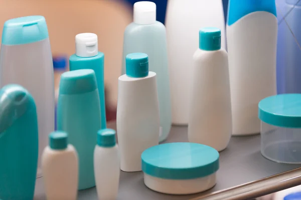 Plastic cosmetic containers, selective focus