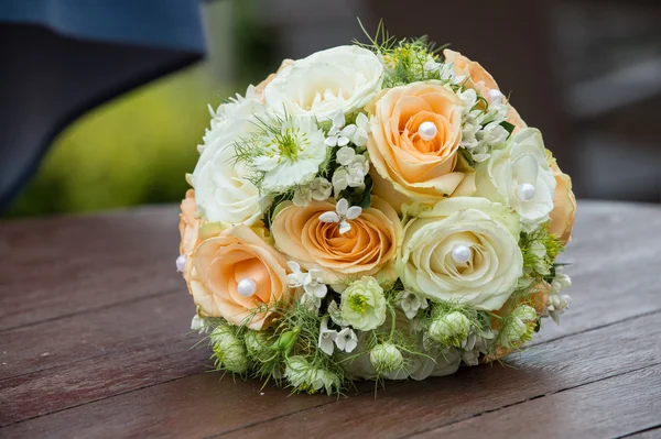 Wedding bouquet on a wood surface