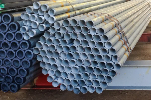 Stack of steel pipes bar - iron metal rail lines material.