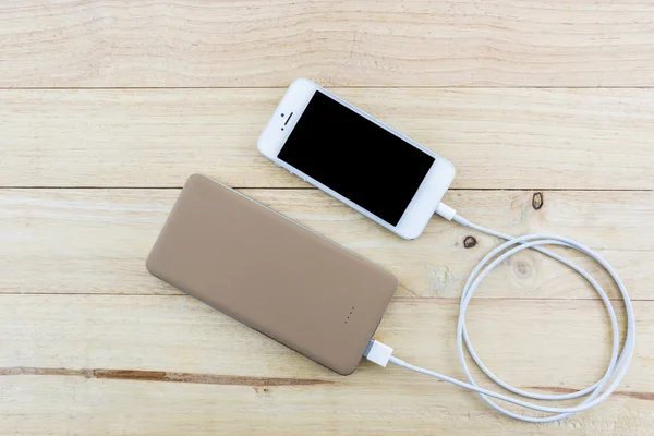 Smartphone with golden powerbank.