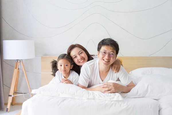 Happy asian family, mother, father and daughter resting on the w