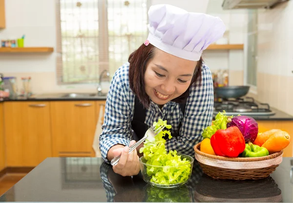Female cook prepare vegetable to make salad