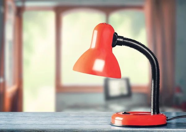 Red table-lamp on table