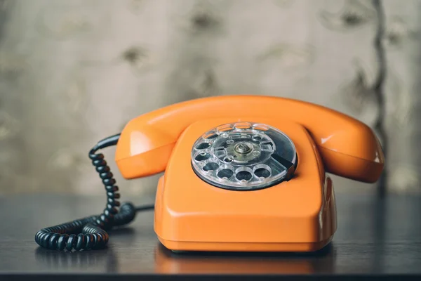 Vintage phone on wooden table