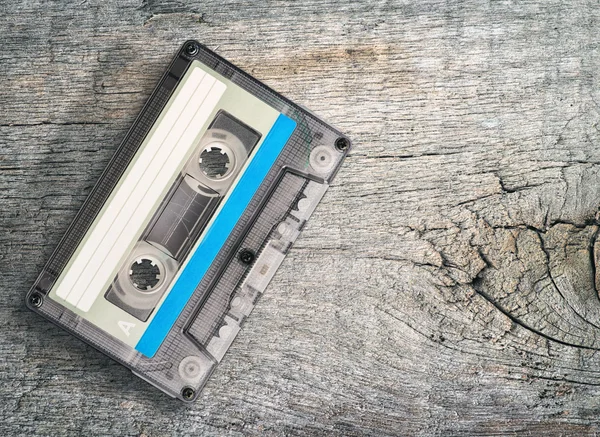 Audio cassette on wooden table