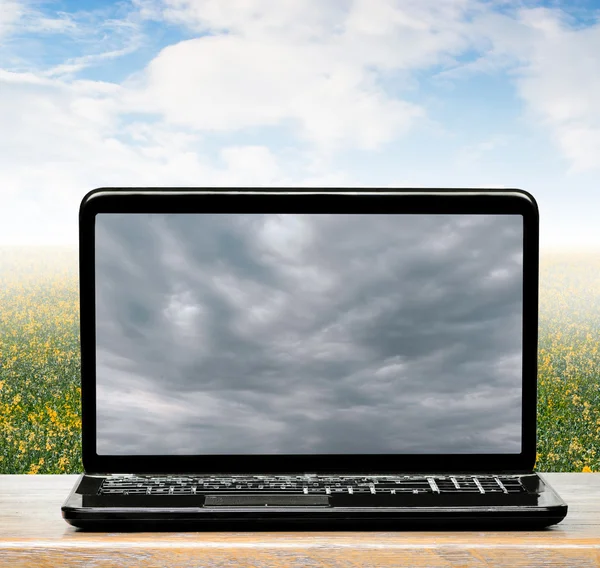 Weather in  world and  clouds on laptop