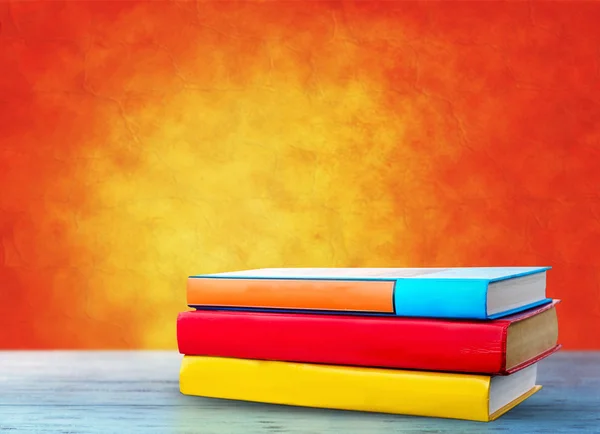 Colorful books on table