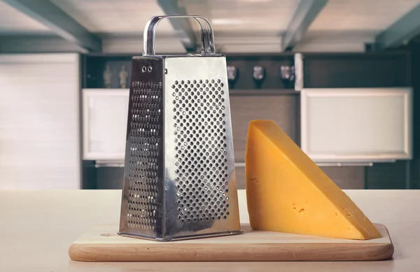 Cheese and grater on kitchen