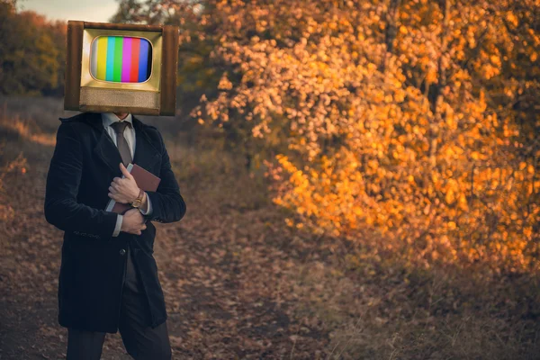 Man with tv on his head