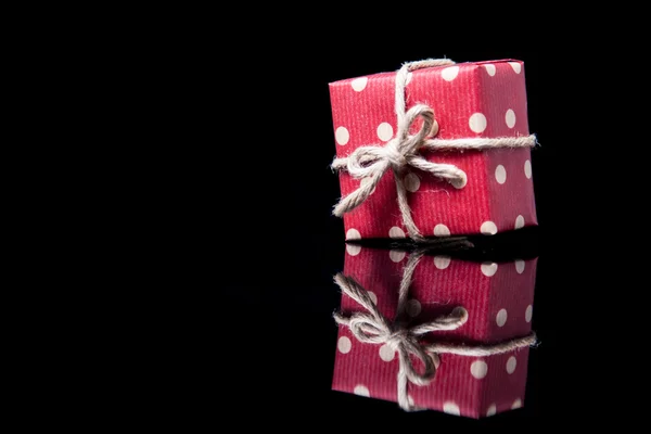 Isolated polka dot red box with bow