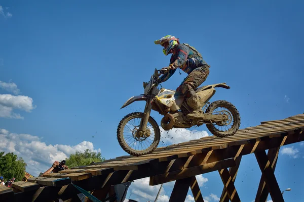 SIBIU, ROMANIA - JULY 18: A copetitor in Red Bull ROMANIACS Hard Enduro Rally with a KTM motorcycle. The hardest enduro rally in the world. July 18, 2015 in Sibiu, Romania.