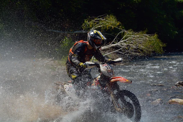 SIBIU, ROMANIA - JULY 18: Unknown competing in Red Bull ROMANIACS Hard Enduro Rally with a KTM 300  motorcycle. The hardest enduro rally in the world.