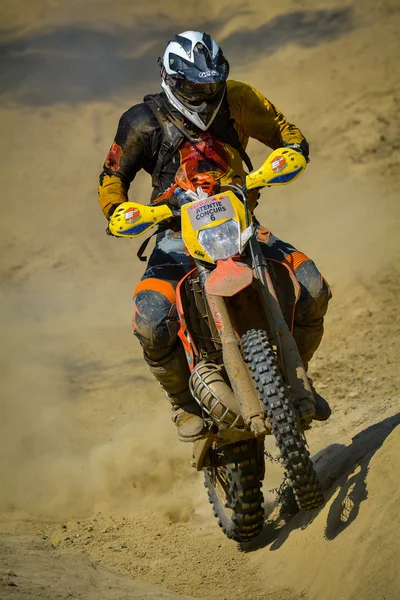SIBIU, ROMANIA - JULY 18: A competitor in Red Bull ROMANIACS Hard Enduro Rally with a KTM motorcycle. The hardest enduro rally in the world. July 18, 2015 in Sibiu, Romania.