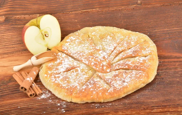 Sweet homemade apple pie and sugar