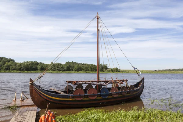 Boat on the river Volkhov at the festival, reconstruction of Ladoga Fest. Lyubsha. Russia.
