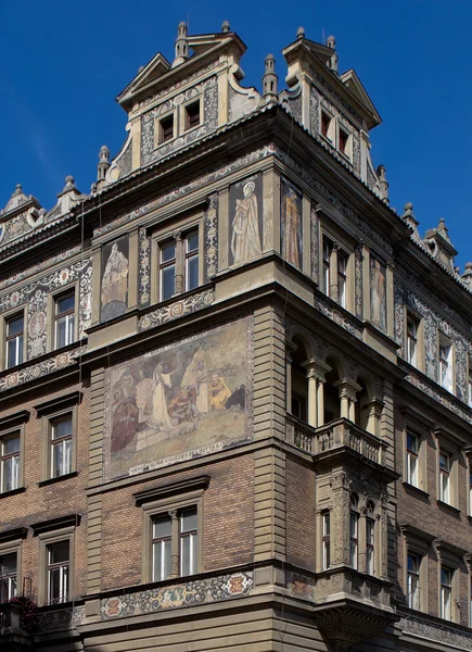 Residential building in the Janacek embankment in the Czech neo-Renaissance style with paintings. Prague. Czech Republic.