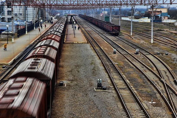 Freight train moving at speed on the road