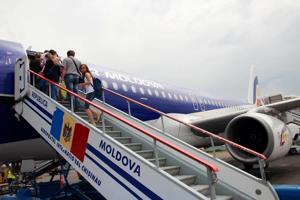 July 3, 2015, Chisinau, Moldova, passengers climb the ladder to board the airship