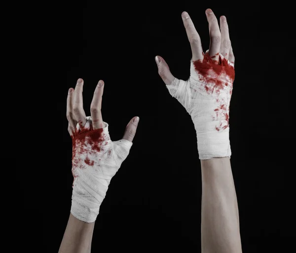 Shook his bloody hand in a bandage, bloody bandage, fight club, street fight, violence, bloody theme, isolated, bloody fists, boxer, tied his hands with a bandage, black background