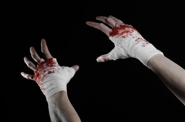 Shook his bloody hand in a bandage, bloody bandage, fight club, street fight, violence, bloody theme, isolated, bloody fists, boxer, tied his hands with a bandage, black background