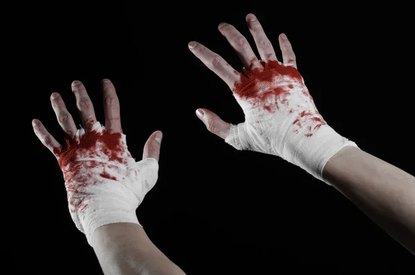 Shook his bloody hand in a bandage, bloody bandage, fight club, street fight, violence, bloody theme, isolated, bloody fists, boxer, tied his hands with a bandage, black background