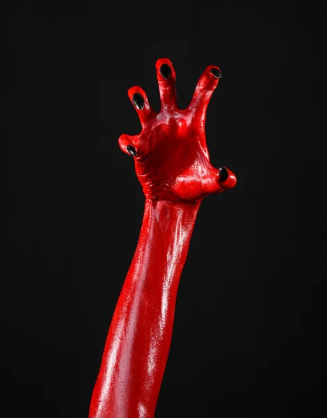 Red Devil's hands, red hands of Satan, Halloween theme, black background, isolated