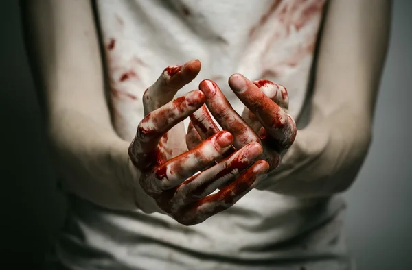 Bloody theme lone murderer: the murderer shows bloody hands and experiencing depression and pain