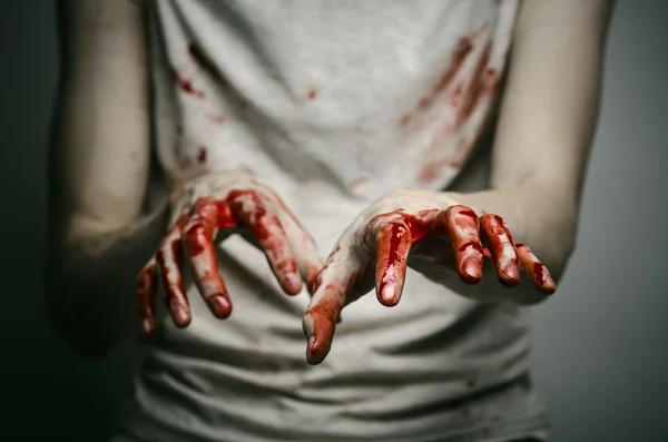 Bloody theme lone murderer: the murderer shows bloody hands and experiencing depression and pain