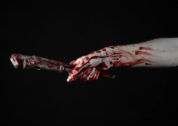 Bloody hand holding an adjustable wrench, bloody key, crazy plumber, bloody theme, halloween theme, black background,isolated , bloody hand of an assassin, bloody murderer, psycho,bloody monkey wrench