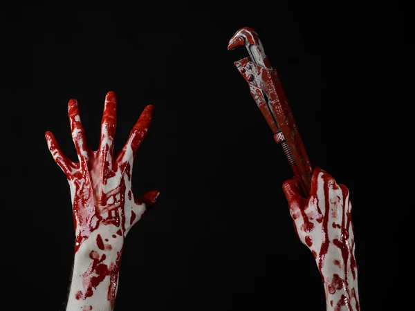 Bloody hand holding an adjustable wrench, bloody key, crazy plumber, bloody theme, halloween theme, black background,isolated , bloody hand of an assassin, bloody murderer, psycho,bloody monkey wrench