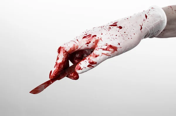 Bloody hands in gloves with the scalpel, white background, isolated, doctor, killer, maniac