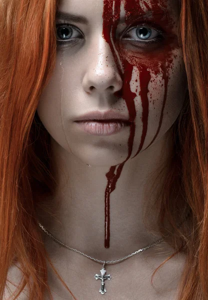 Girl with red hair, bloody face, a chain with a cross, blue eyes, vampire, murderer, psycho, halloween theme, studio shot, bloody woman