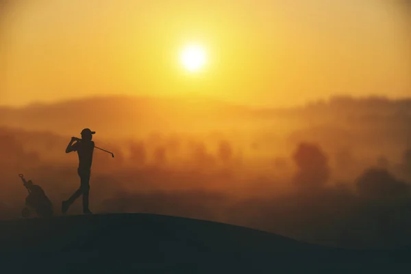 Silhouette of golfers hit sweeping and keep golf course in the s