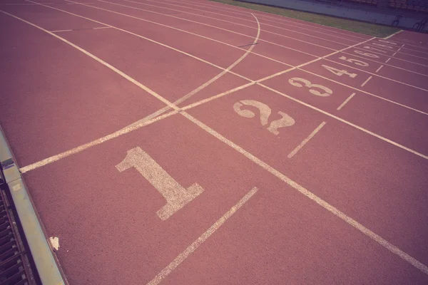Numbers on running track  in stadium vintage color