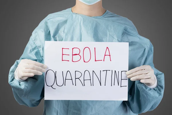 Scientist in safety suit drawing word ebola quarantine
