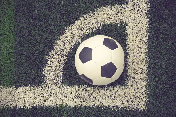 Soccer ball on soccer field vintage color