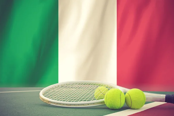Tennis ball on ITALY flag background.vintage color