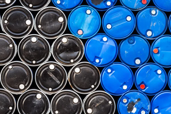 Blue and black oil barrels