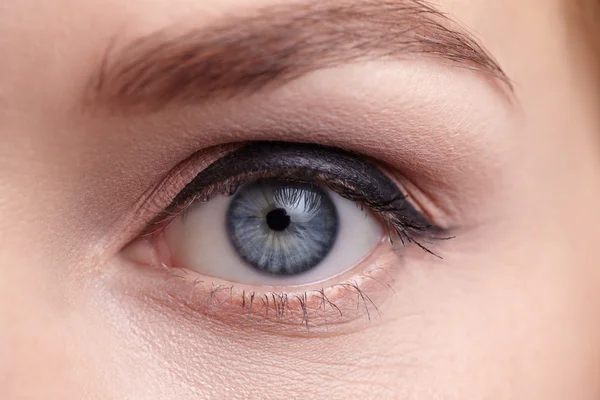 Close-up of female eye. Make-up arrow.