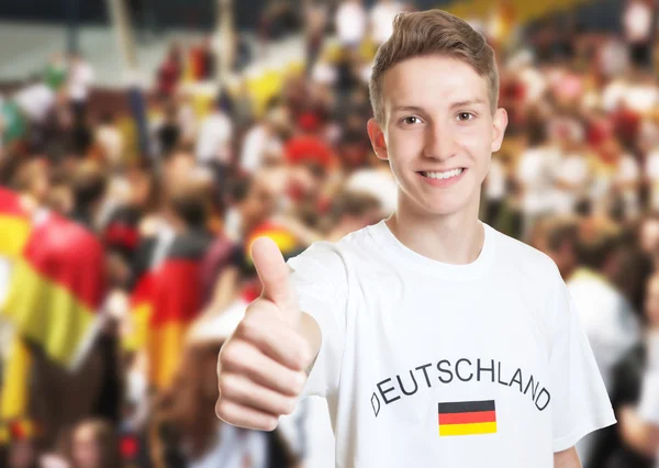 Attractive german fan showing thumb with other fans