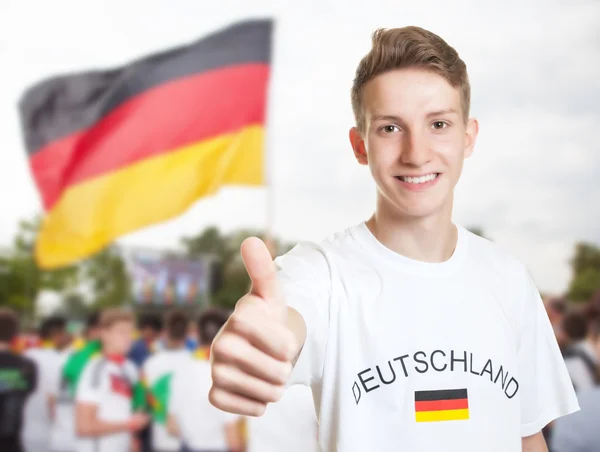 German fan showing thumb with other fans