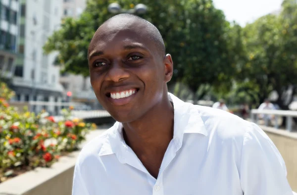 Attractive african american man in white shirt outdoor