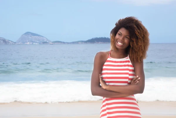 Beautiful african american girl with crazy hairstyle and striped