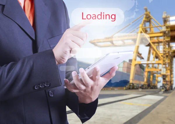 Businessman holding a tablet with loading bar on the screen