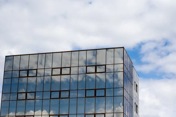 Office building with clouds