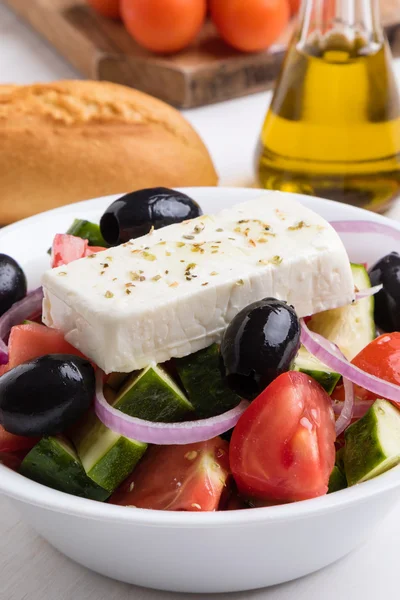 Greek salad in white bowl